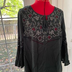 Cato’s dark green blouse